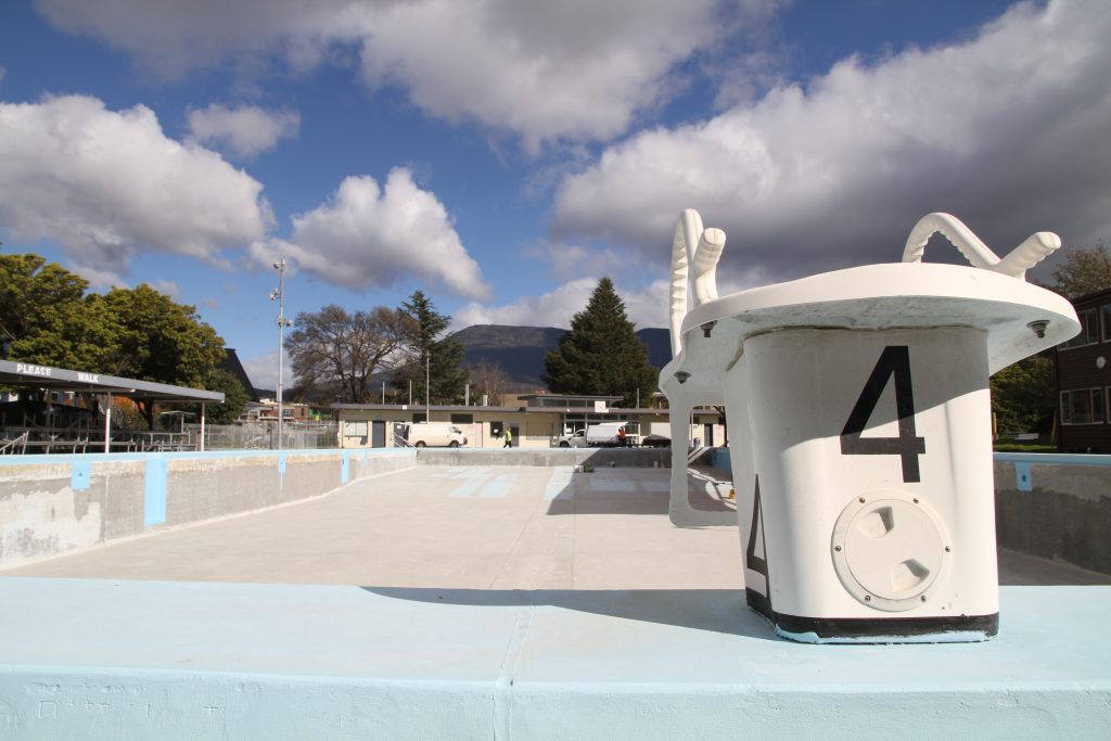 An image of the Glenorchy War Memorial Pool, sitting empty. The photo includes diving platform four.