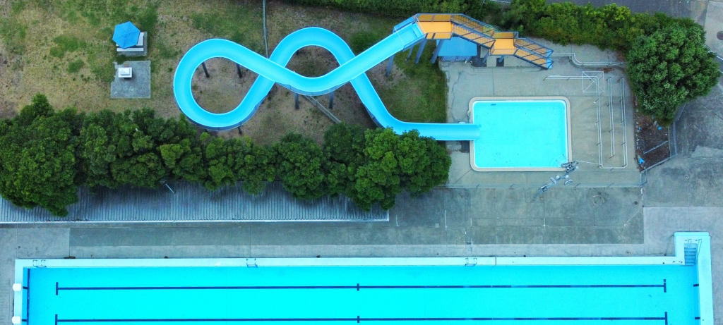 An image of the Glenorchy War Memorial Pool and slide, taken from above.
