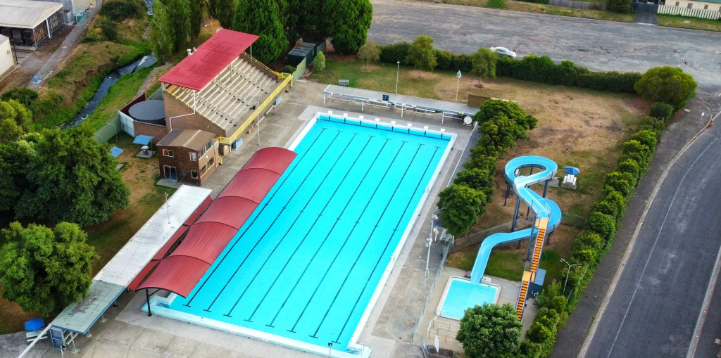 A picture of the Glenorchy War Memorial Pool, slide and stands, taken from above.